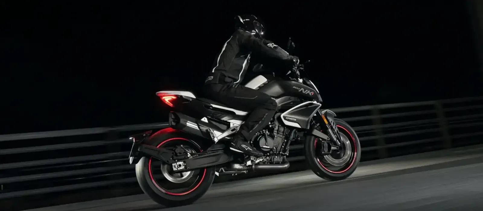 A flyby of the  black and white CFMOTO 800NK naked bike.
